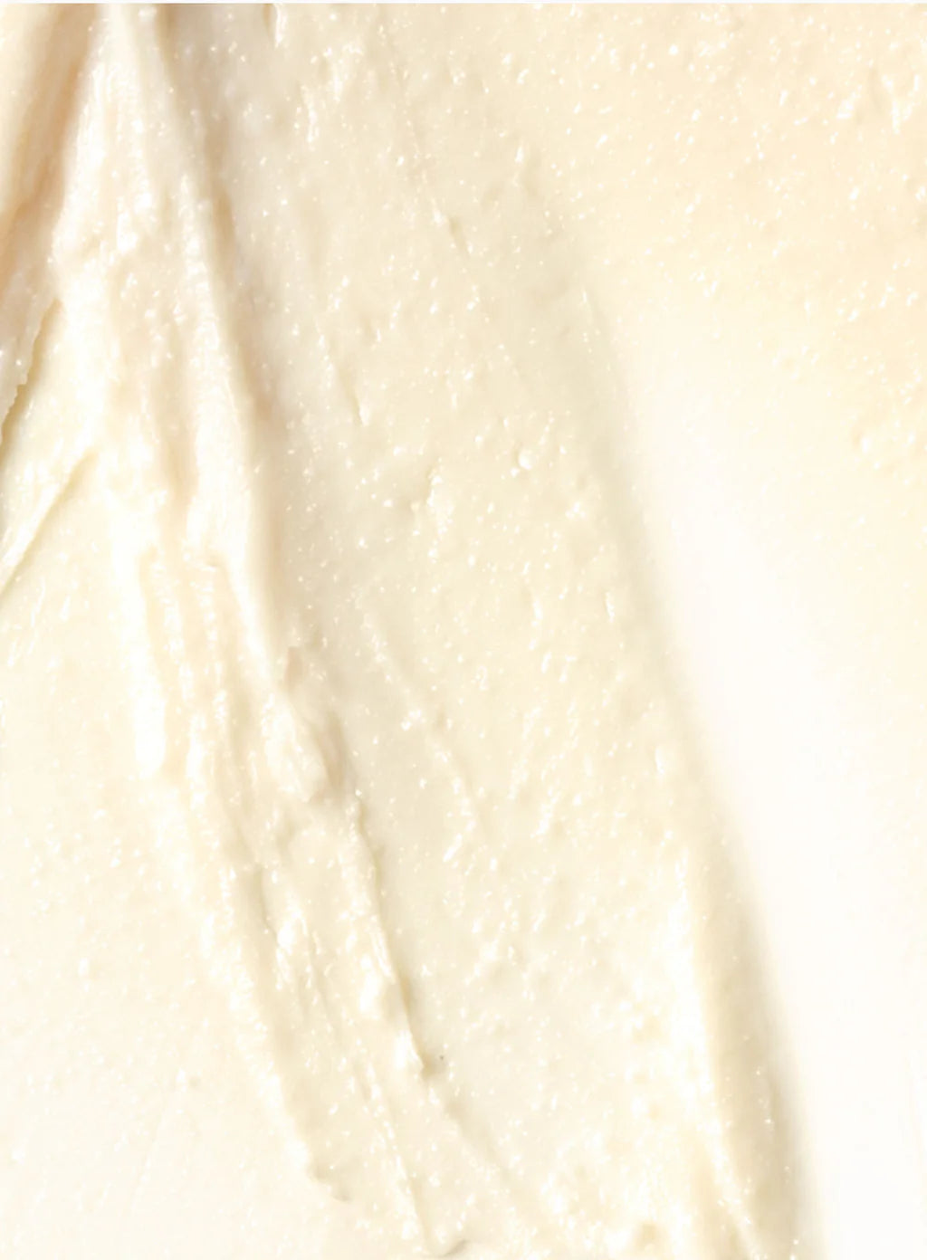 Close-up of smooth, light-colored cream or lotion texture