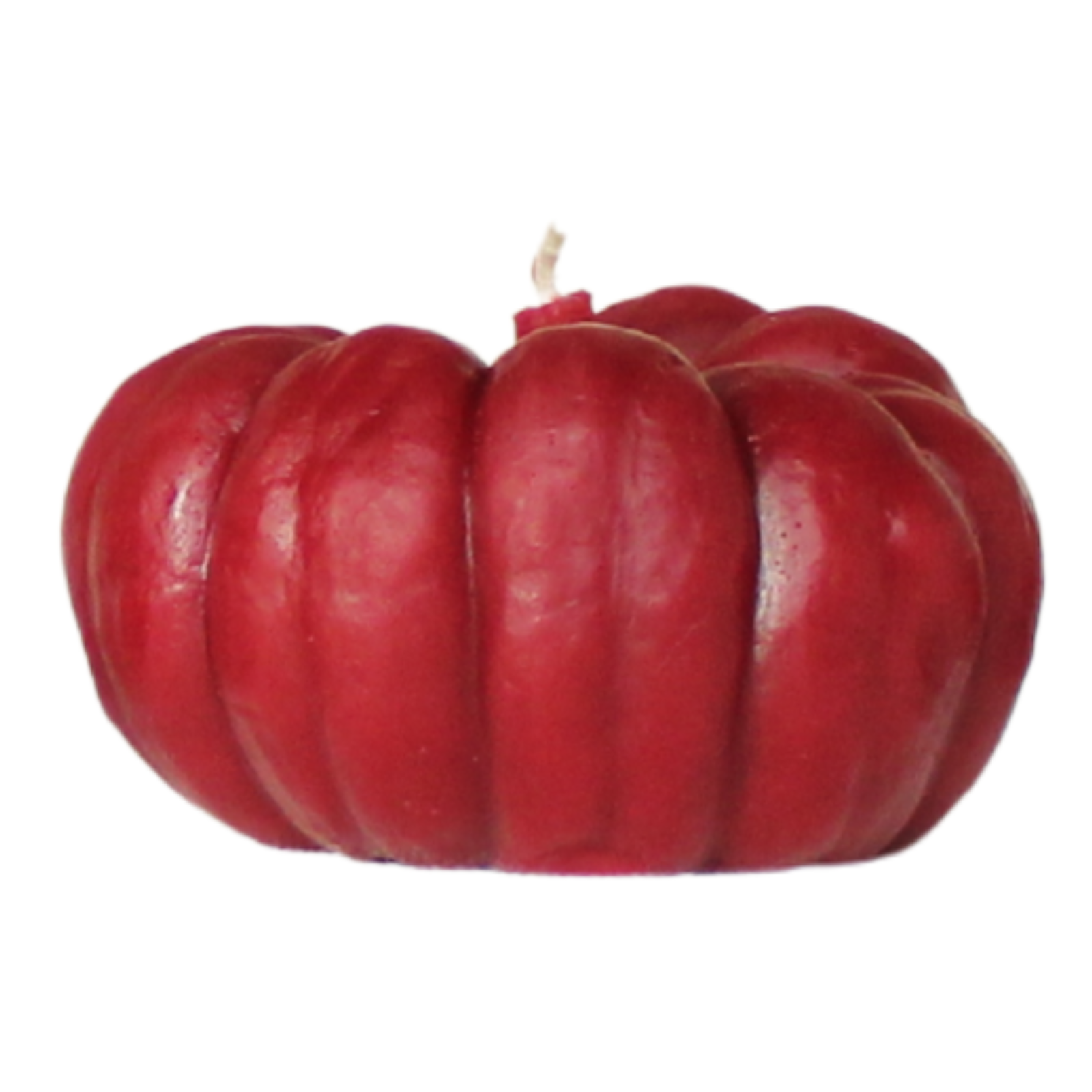 Red pumpkin-shaped candle on a white background
