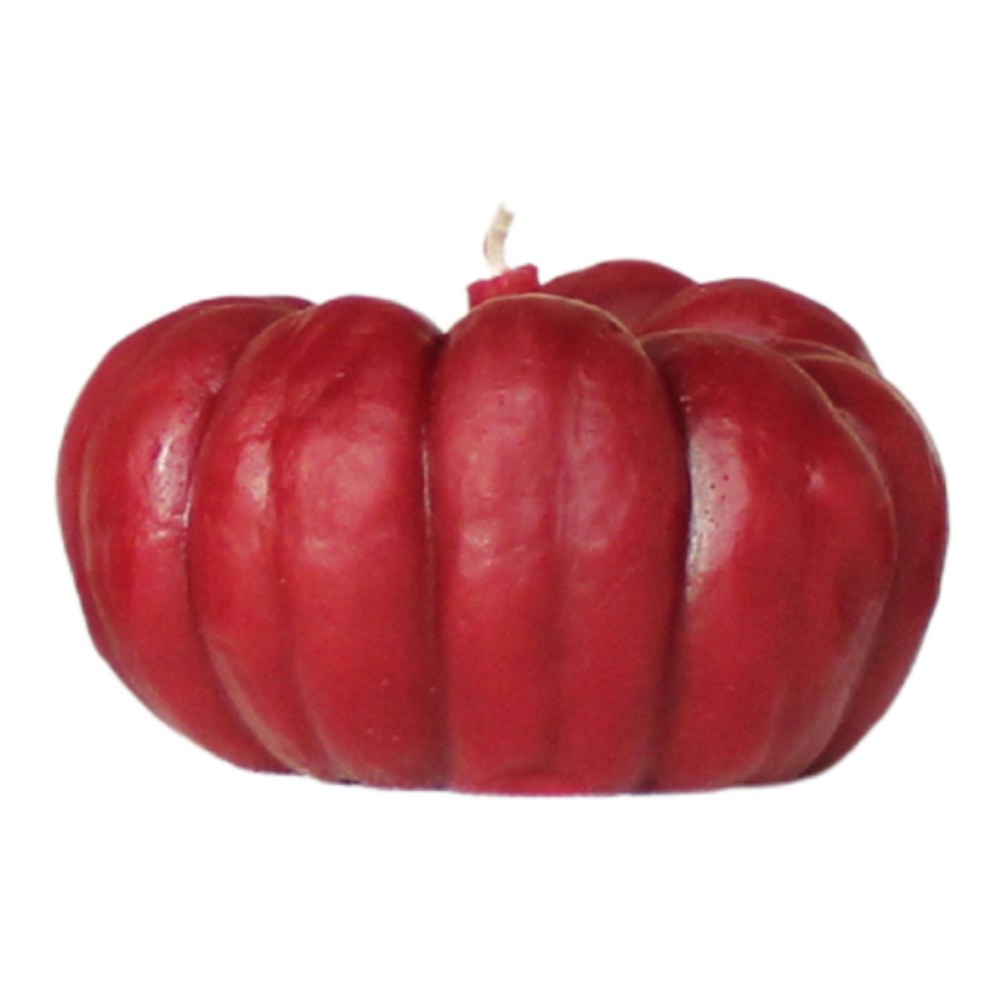 Red pumpkin-shaped candle on a white background