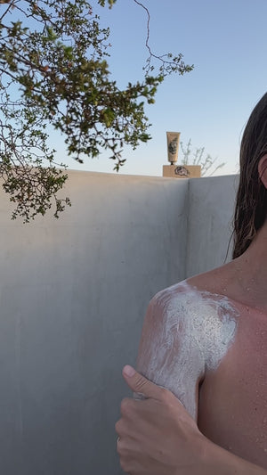 A video of a person using Wonder Valley seaweed scrub