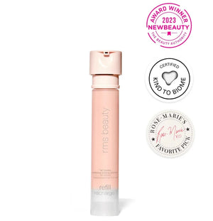 Pink refillable bottle with awards on a white background