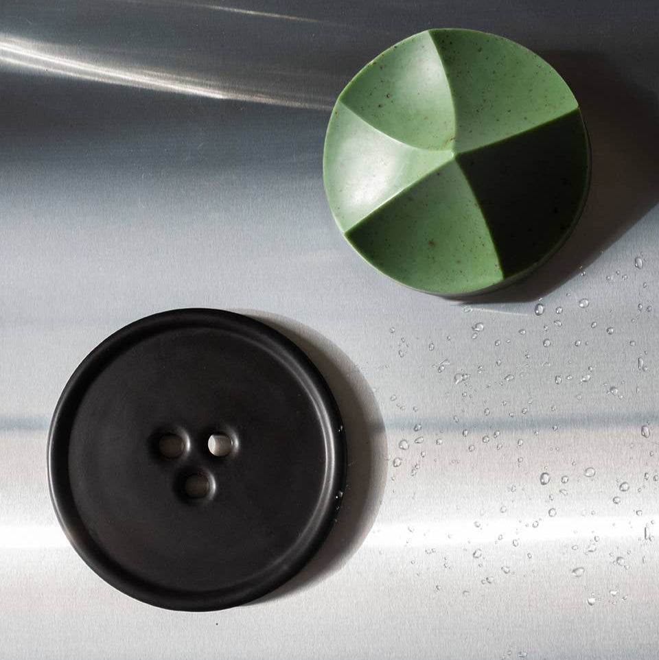 An ume studios erode soap and a black bouton. 