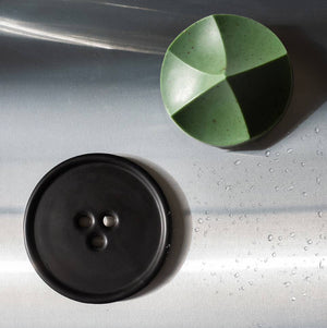 An ume studios erode soap and a black bouton. 