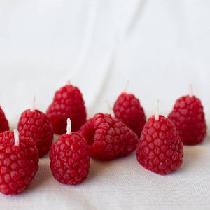 A group of raspberry candles