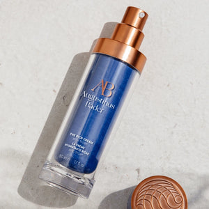 A bottle of the rich cream on a white speckled surface