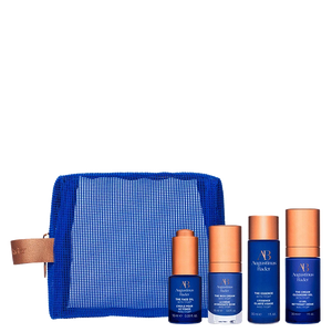 Set of skincare products with a blue pouch on a white background