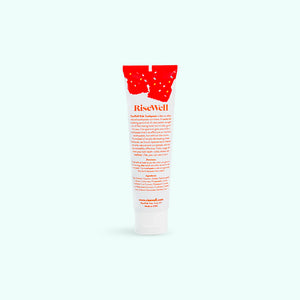 A tube of rise well kids toothpaste