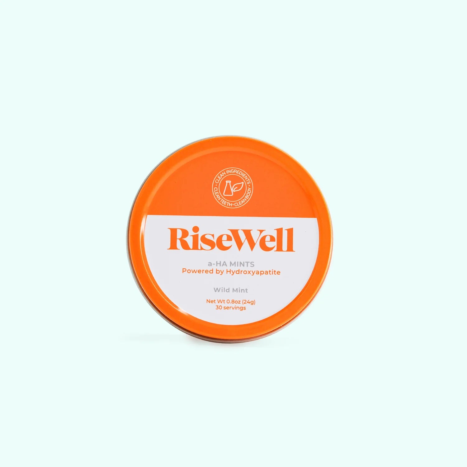 Orange and white container of RiseWell mints on a light blue background