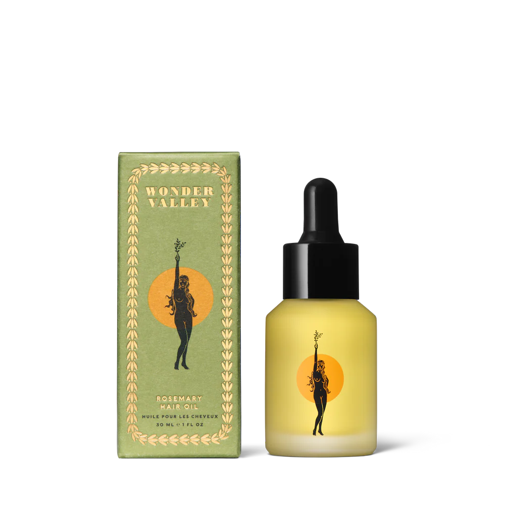 Bottle and box of Wonder Valley hair oil on a white background