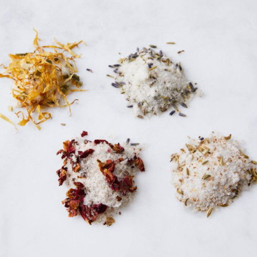 Four different types of flavored salts in small piles