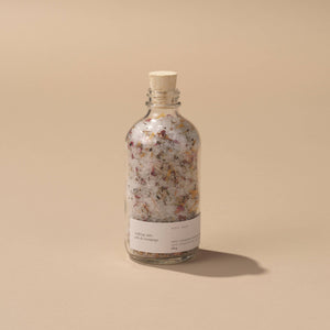 A glass bottle of Well Kept Soaking Salts - Ivory 