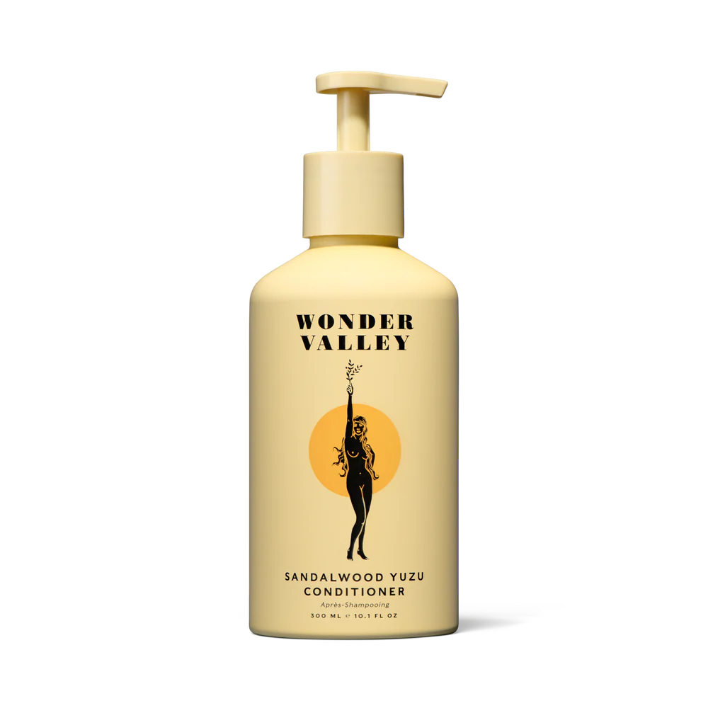 A bottle of the Sandalwood Yuzu hair conditioner, made by Wonder Valley in California