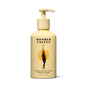 A bottle of the Sandalwood Yuzu hair conditioner, made by Wonder Valley in California