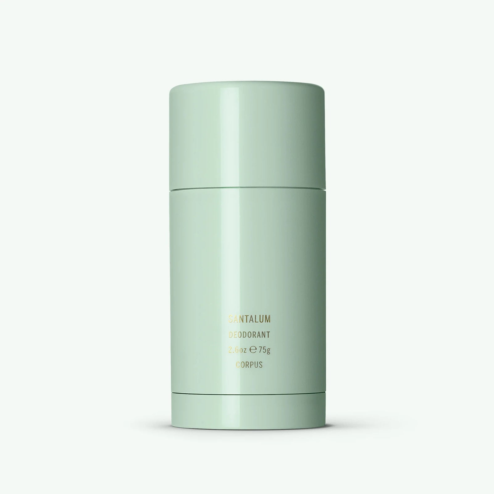A stick deodorant with a green cap and body, labeled 'Corpus | Santalum Deodorant'.