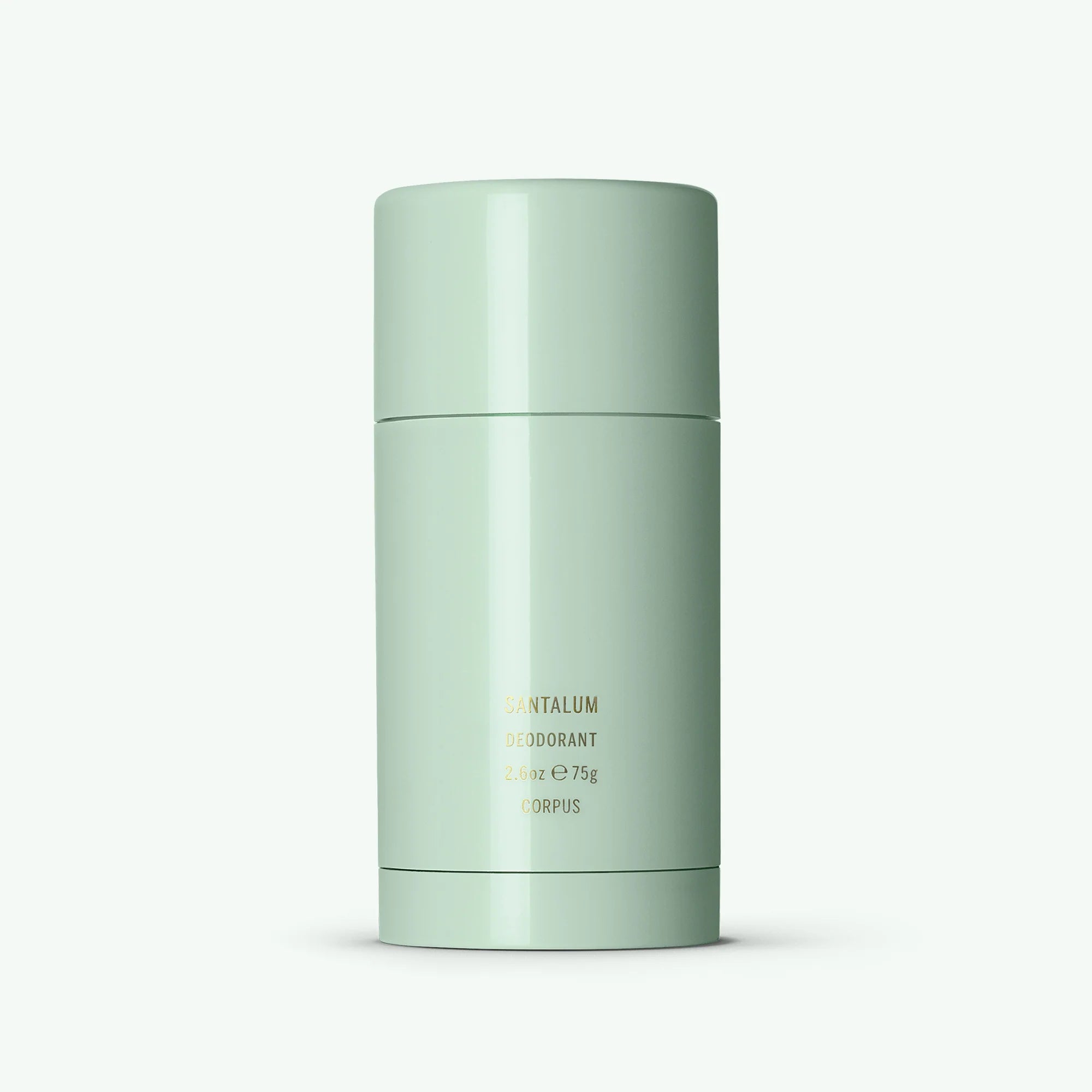 A stick deodorant with a green cap and body, labeled 'Corpus | Santalum Deodorant'.