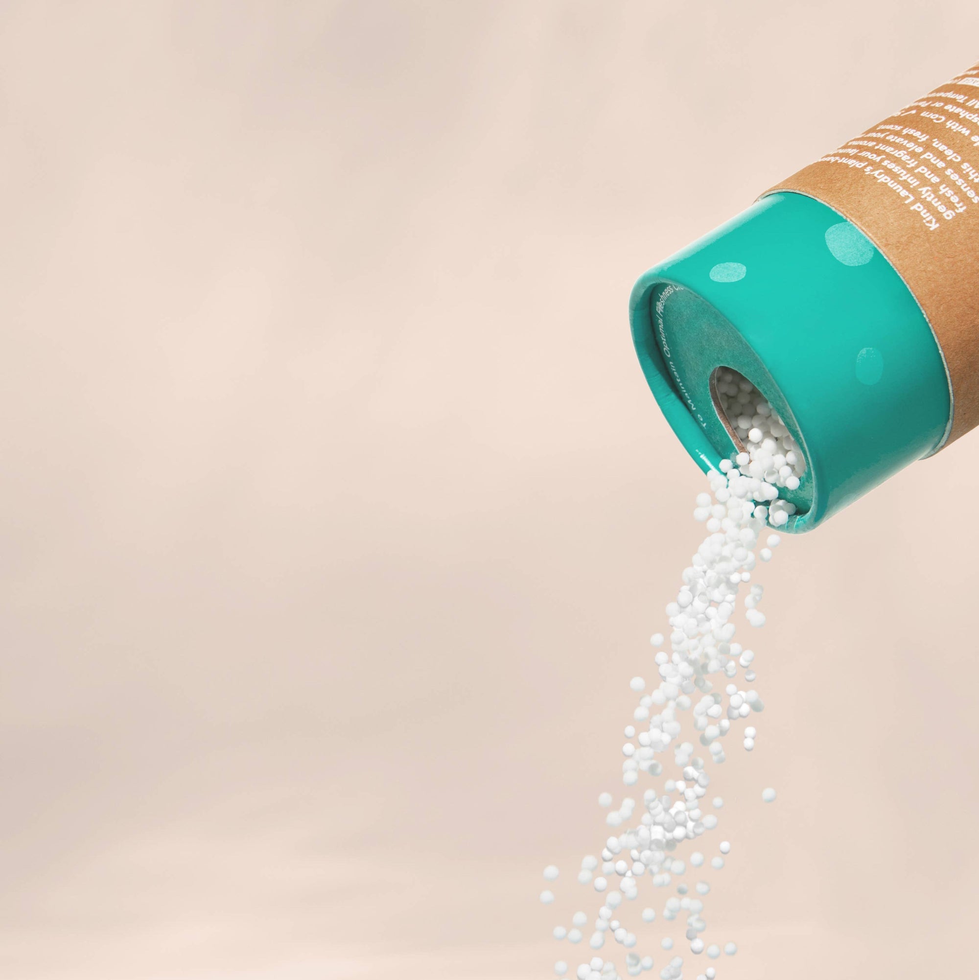 A bottle of Kind Laundry In Wash Scent Booster, in Ocean breeze