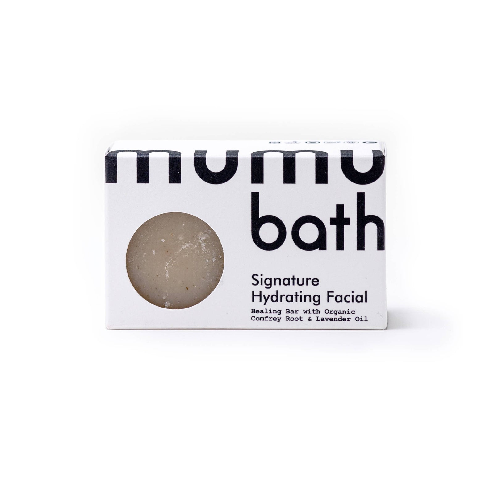 A bar of mumu bath hydrating facial soap on a white background. 