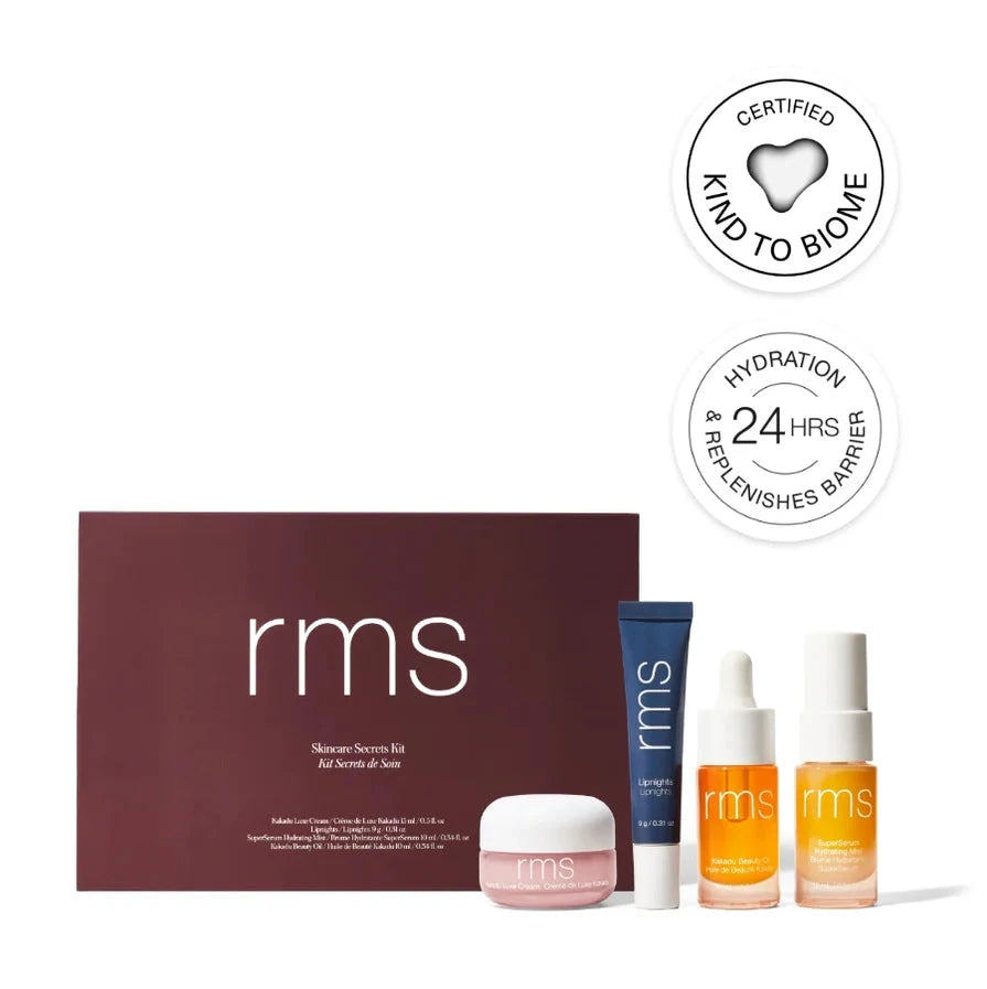 The RMS skincare secrets kit, a brown box containing the RMS lipnights treatment, the Kakadu cream, Kakadu beauty oil, and the hydrating mist