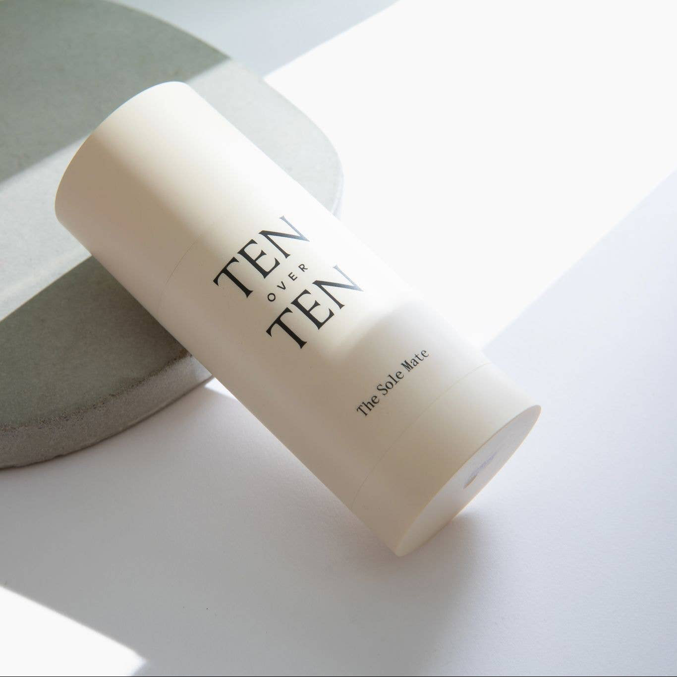 White cylindrical container with 'Ten of Ten' branding on a light background