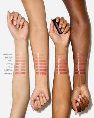 Lipstick swatches on multiple arms with a white background
