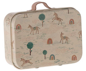 A small metal suitcase with a beige background featuring colorful illustrations of unicorns, horses, trees, and rainbows.