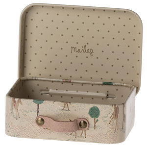 Small storage box with polka dot interior and animal design exterior.