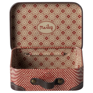 Patterned suitcase with open lid showing interior on a white background