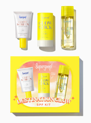 Supergoop! Destination Glow SPF kit with various skincare products on a white background