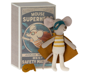 Toy mouse in a superhero costume with a matching box on a white background