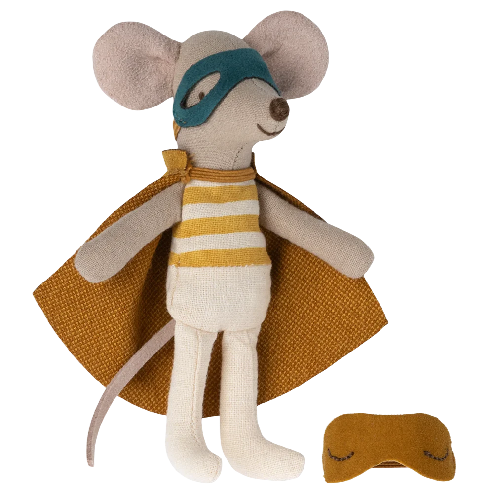 Toy mouse in superhero costume with cape and mask on a white background