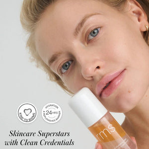 A woman holding a bottle of RMS super serum to her chin. The text reads "skincare superstars with clean credentials"