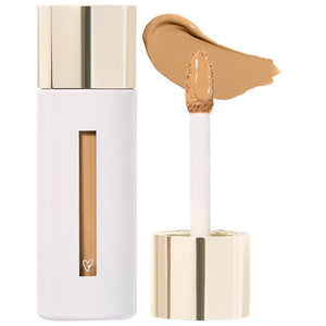 Cosmetic concealer with applicator and swatch on a white background