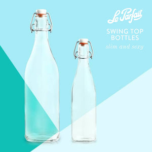 Two glass swing top bottles on a blue background. 