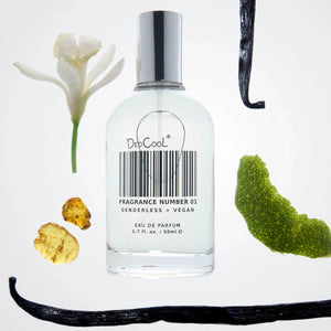 A bottle of dedcool taunt with vanilla beans, a flower and a lime peel