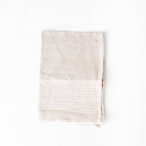 A color block tea towel in beige and white. 