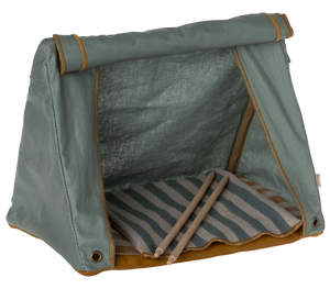Green pet tent with striped mat on white background