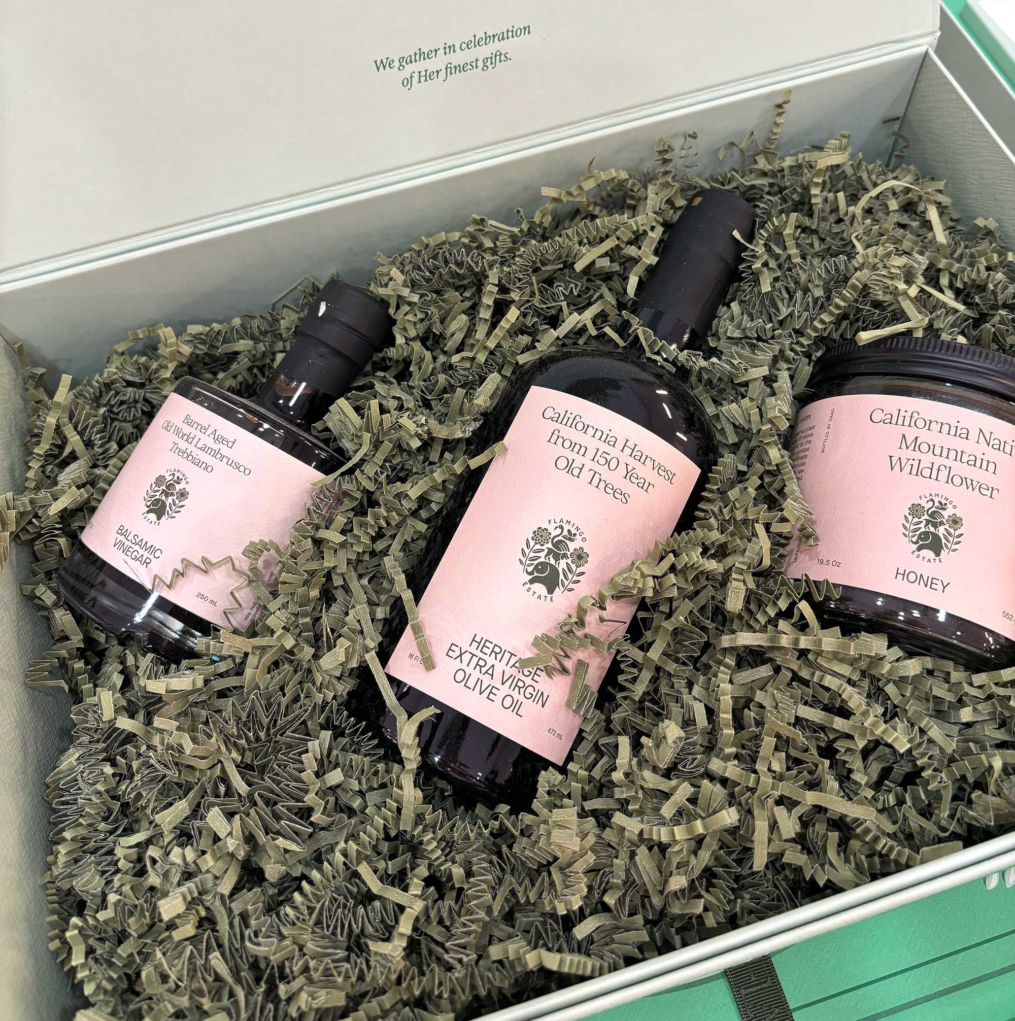 A Flamingo Estate Chef set includes a jar of California honey, a bottle of olive oil, and a bottle of balsamic vinegar