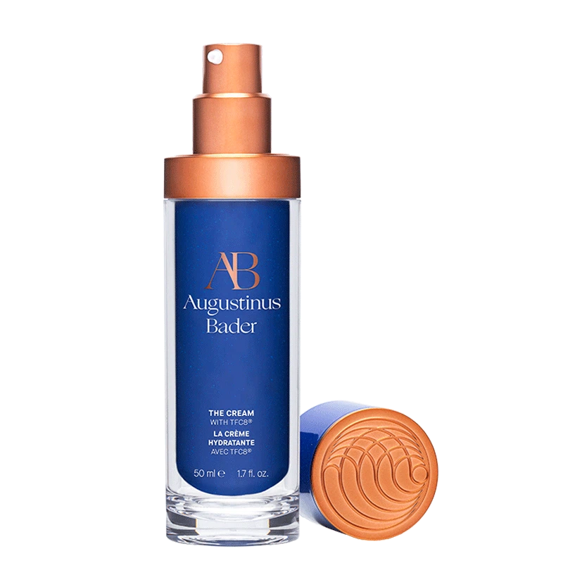 Augustinus Bader the cream bottle with blue and copper design on a white background