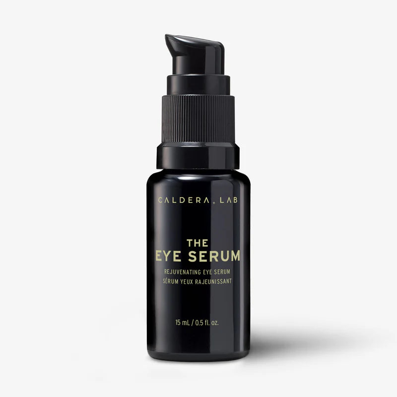 A black pump bottle labeled 'Caldera + Lab | The Eye Serum' with white and gold text on the label.