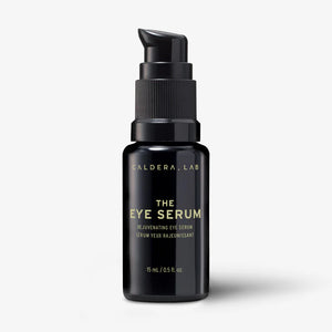 A black pump bottle labeled 'Caldera + Lab | The Eye Serum' with white and gold text on the label.