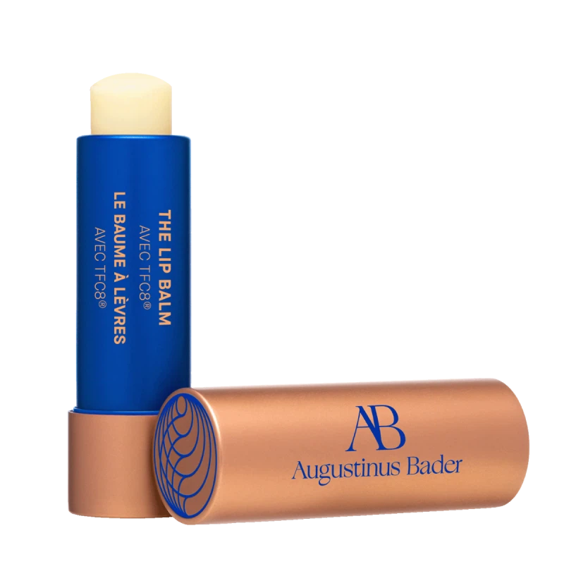A tube of Augustinus Beer The Lip Balm with a copper top