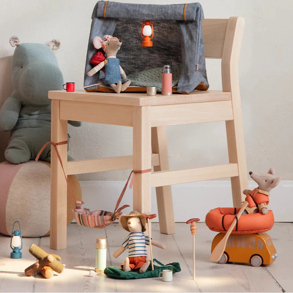 A set of toy thermos and cups in green and beige colors, designed to be used by a toy mouse.