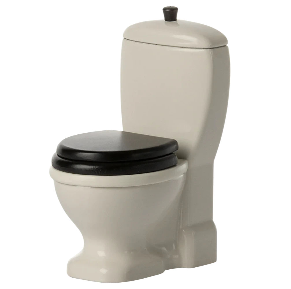 Beige toilet with black seat on a white background