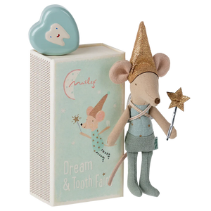 Stuffed mouse toy with fairy outfit and accessories in front of a decorative box.