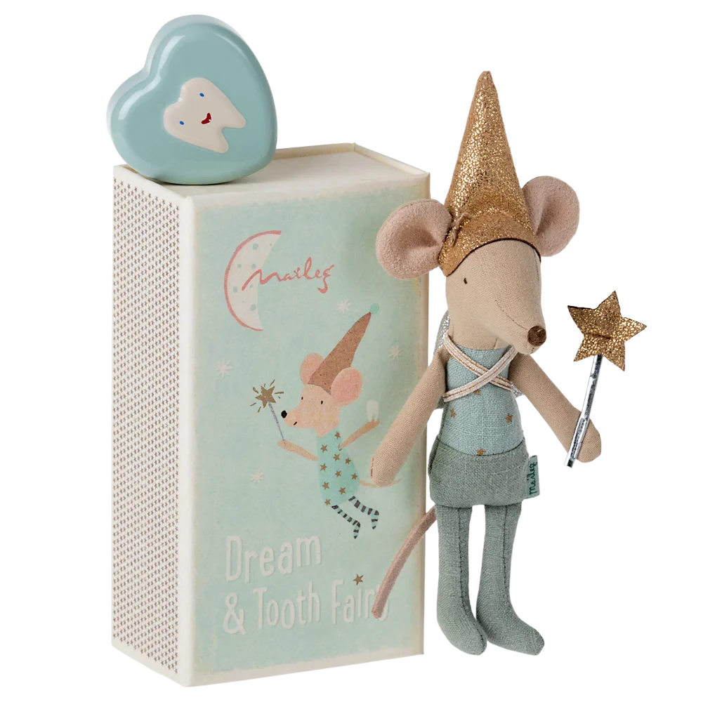 Stuffed mouse toy with fairy outfit and accessories in front of a decorative box.