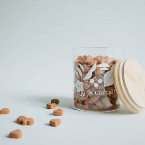 A canister of botanical bones dog treats