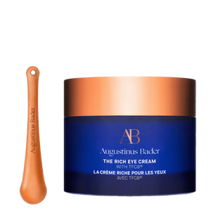 Augustinus Bader eye cream jar with applicator on a white background