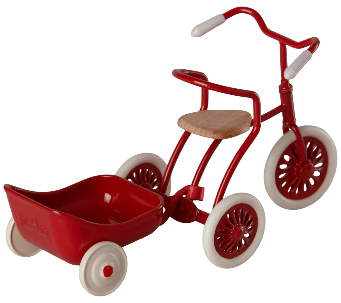 A red metal tricycle hanger with a white wheel, designed to be attached to a tricycle for additional storage.