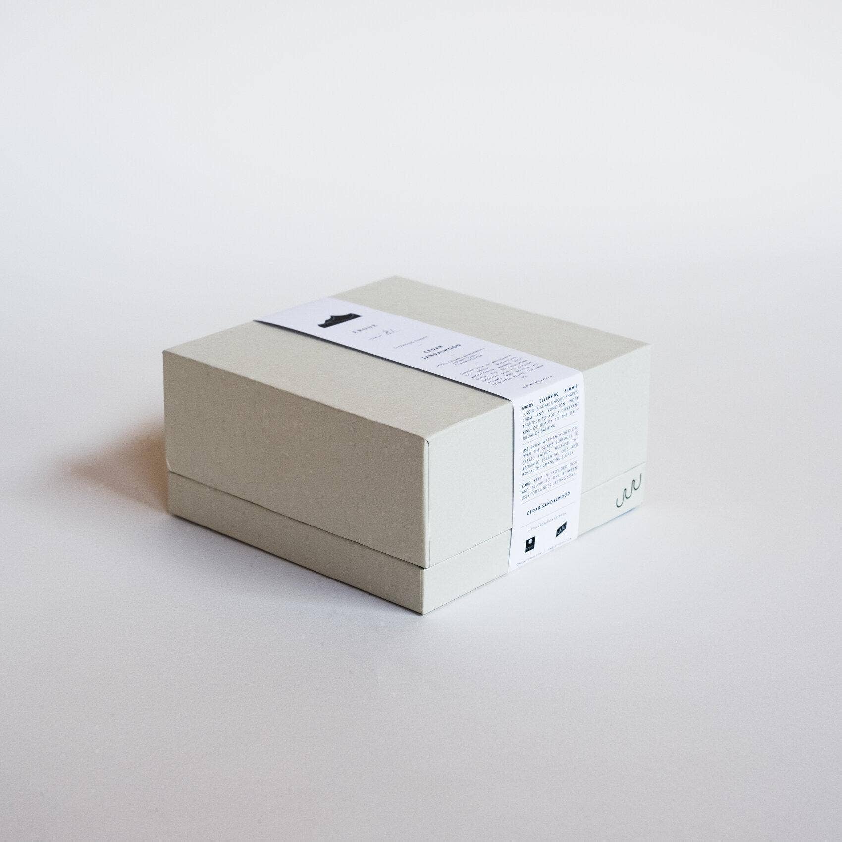 An UME Studios cedar sandalwood soap, in a grey box