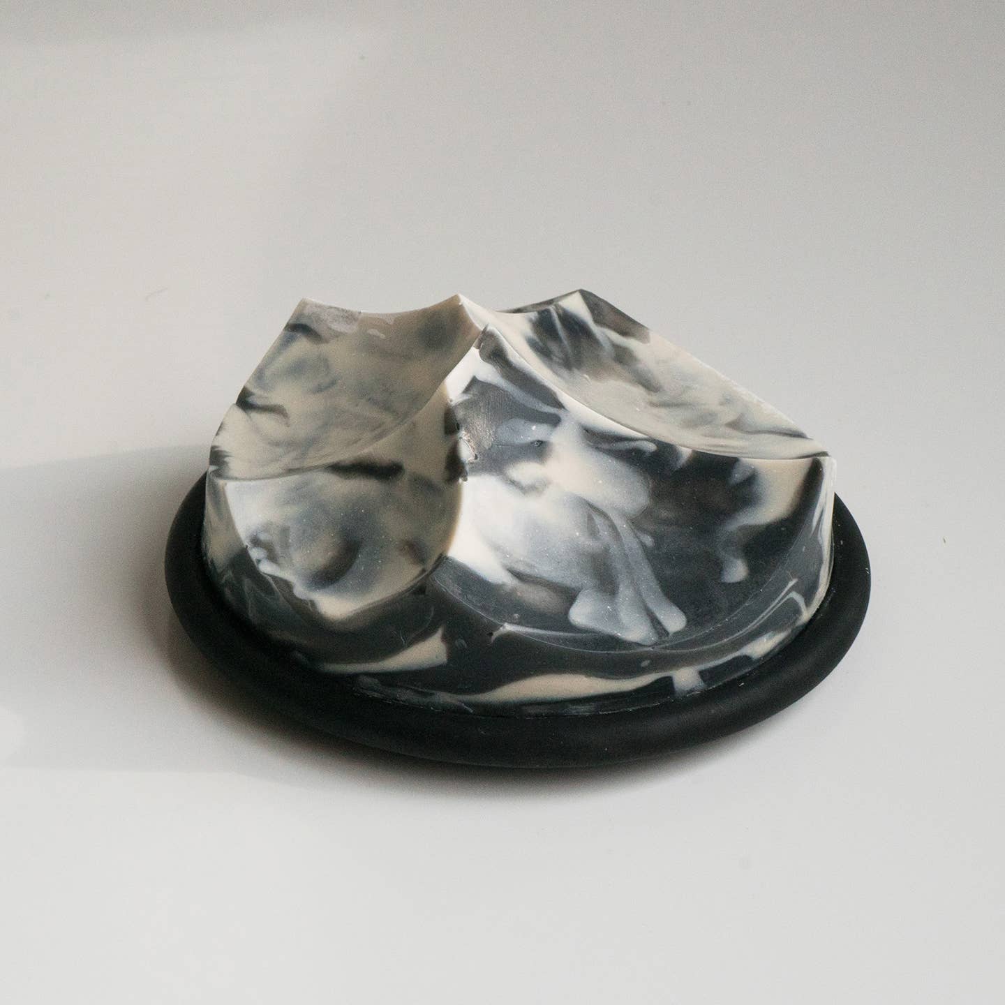 An ume studios architectural soap on a black bouton. 